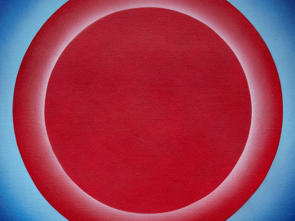 Red circles overlapping that look like targets, painted against a fading blue background