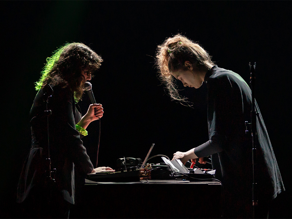 Pollution Opera - Nadah El Shazly & Elvin Brandhi - performing over laptops and gear on a dark stage