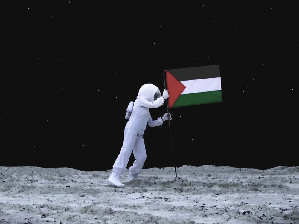 An astronaut plants a Palestinian flag on the moon